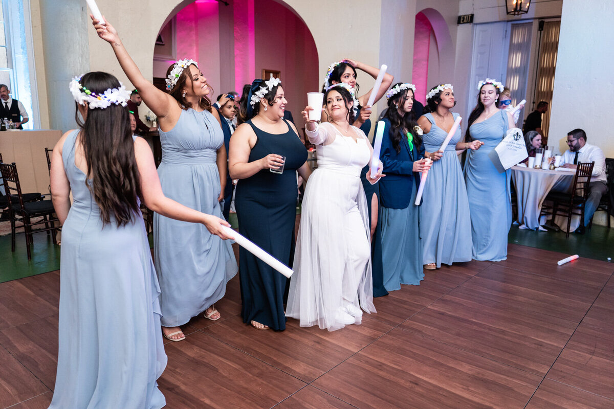 Bride and bridesmaids having fun