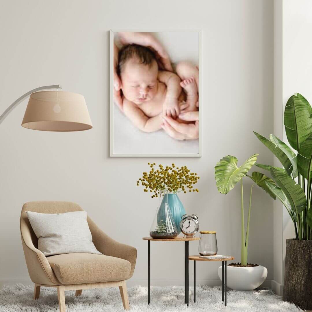 Mockup of living room with newborn portrait