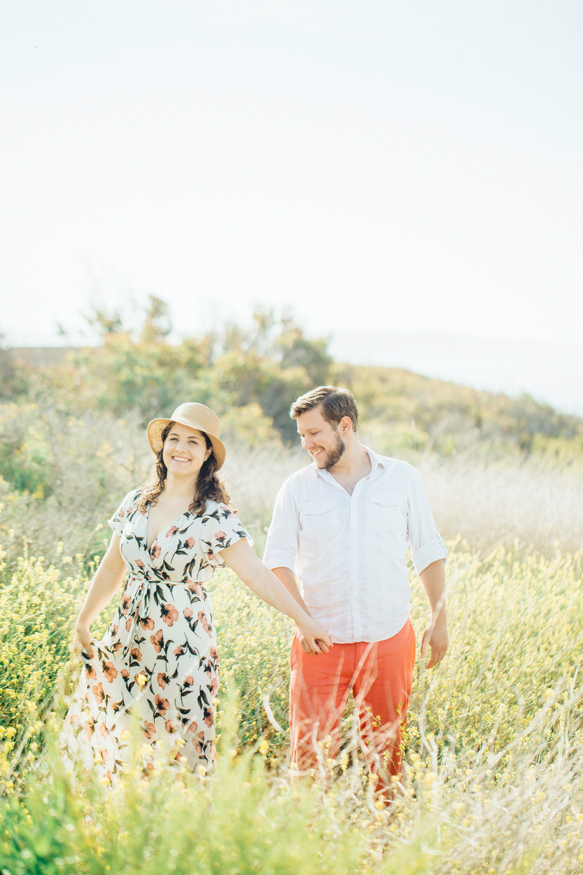 Engagement Photograph Of  Man And Woman Laughing While Holding Hands Los Angeles