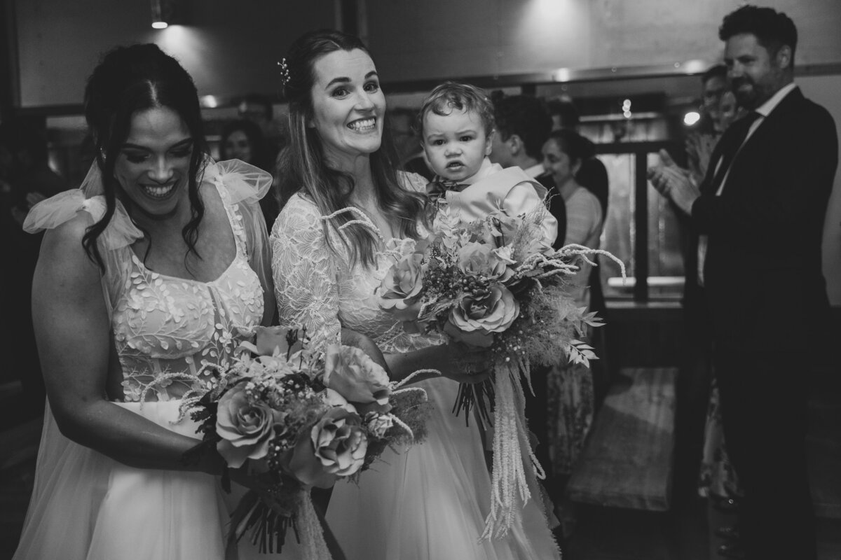 The family walking out of their ceremony