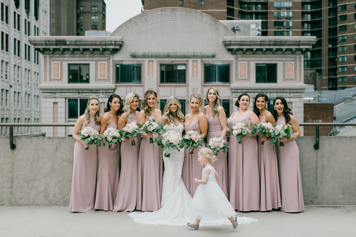 Bride photographed with her bridesmaids on the Double Tree's rooftop on Broad Street in Philadelphia.