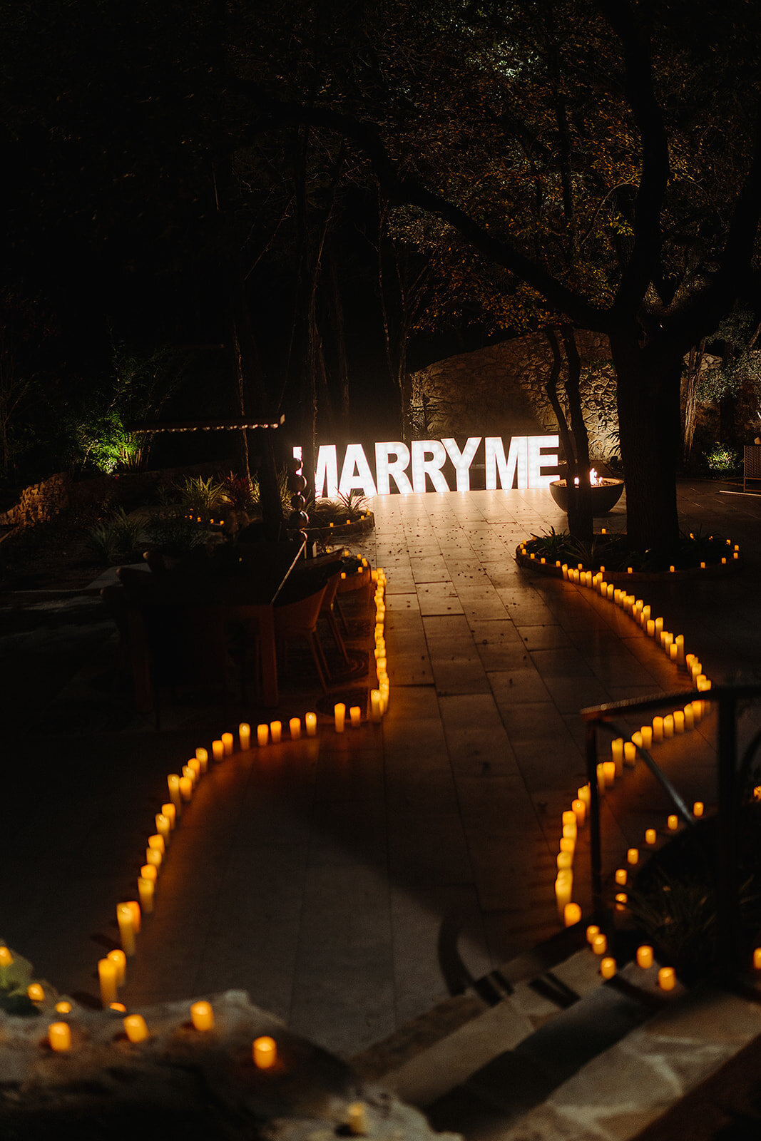 How to propose Austin candlelit walkway to marry me marquee