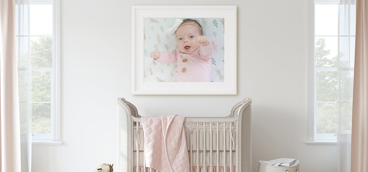 pink nursery with framed photo on the wall taken by a Virginia photographer