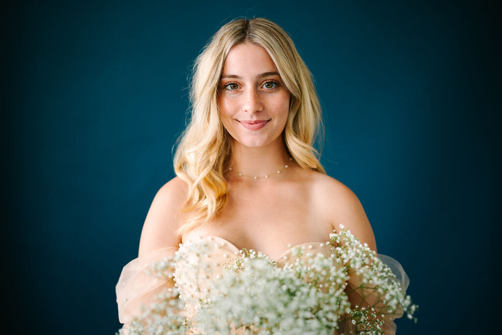 A person in a dress with a smile on their face 