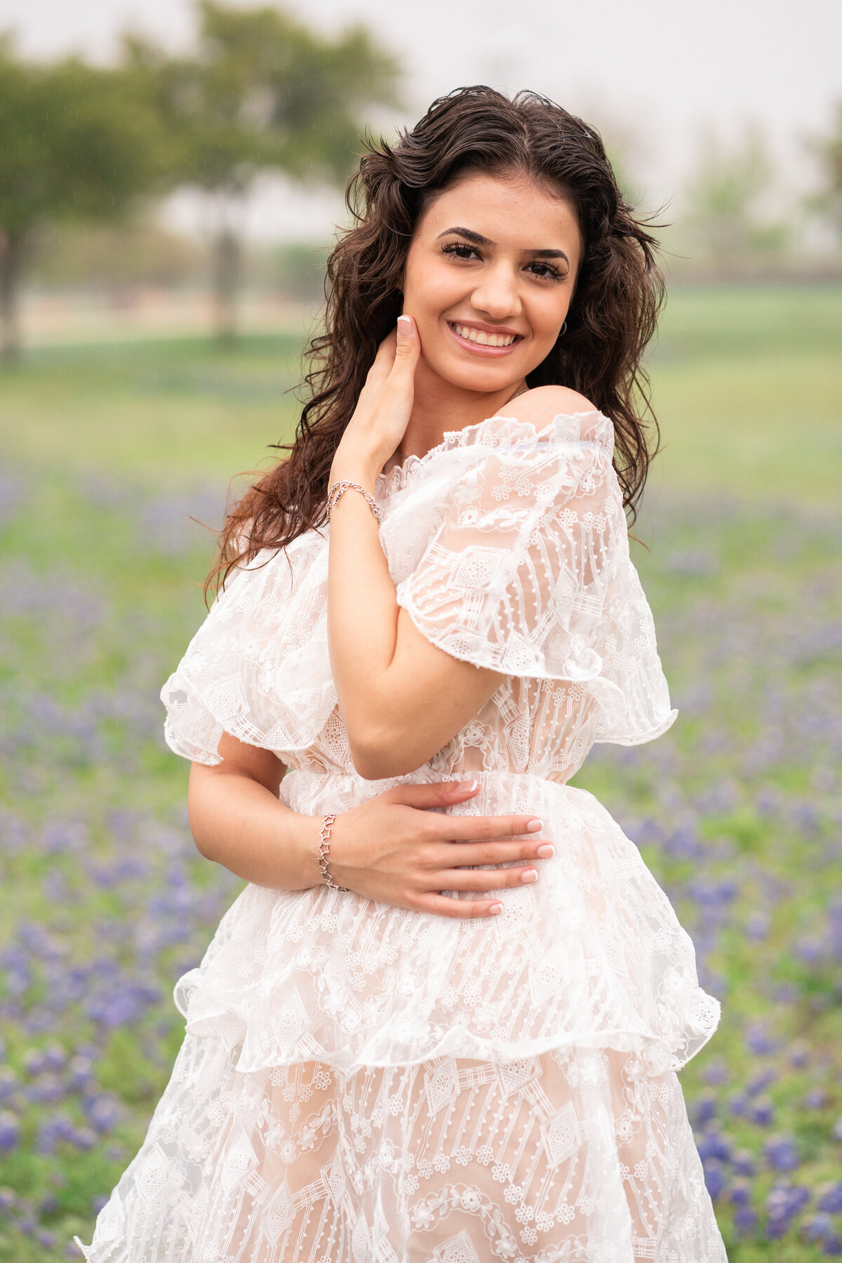 High school senior girl wearing a white dress in Austin Texas.