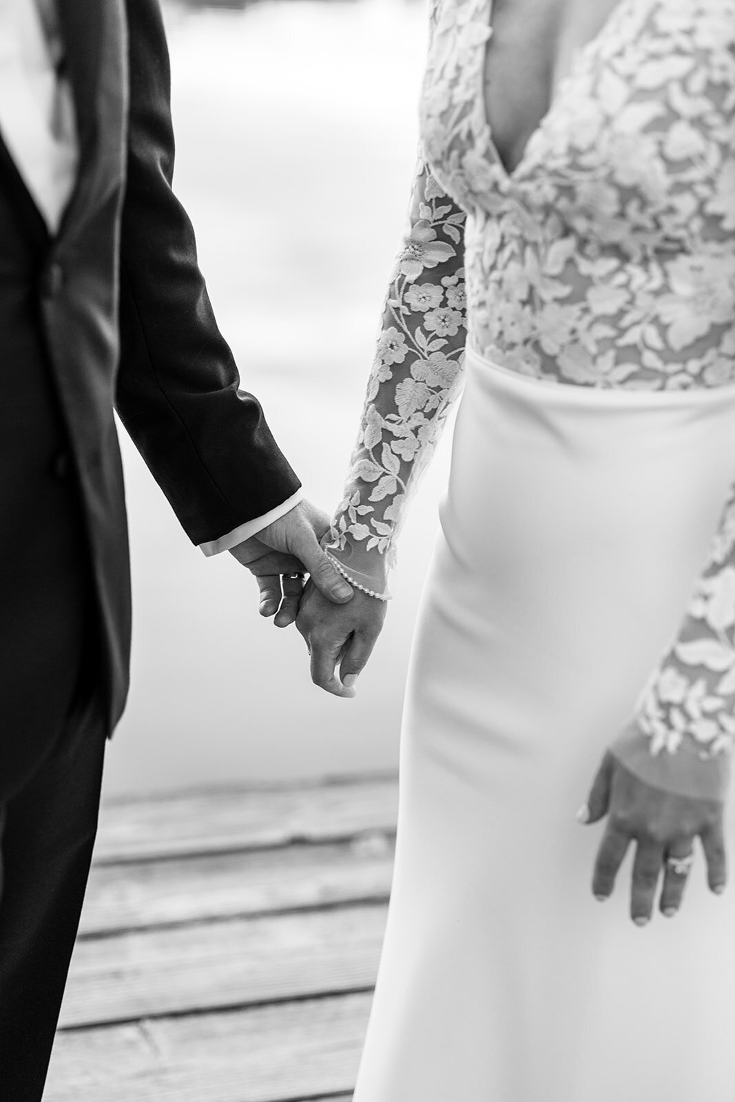 Black and white wedding photo of hands