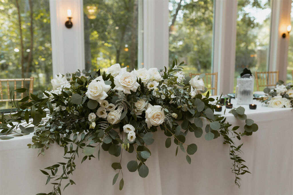 Head table wedding reception florals by Bloomdigity Floral Studio, an contemporary, Lethbridge, Alberta wedding florist, featured on the Brontë Bride Vendor Guide.
