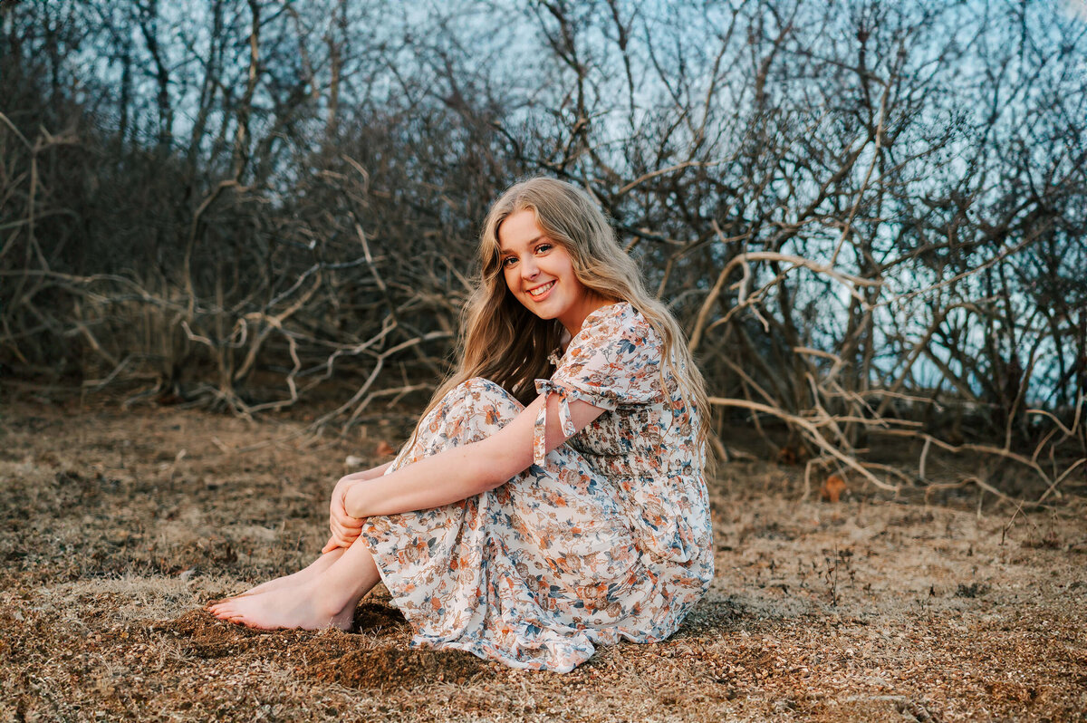Branson Missouri senior photo of high school senior sitting in sand