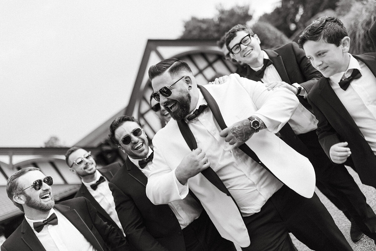 groom-and-groomsmen-wedding-photos-at-saint-clements-castle