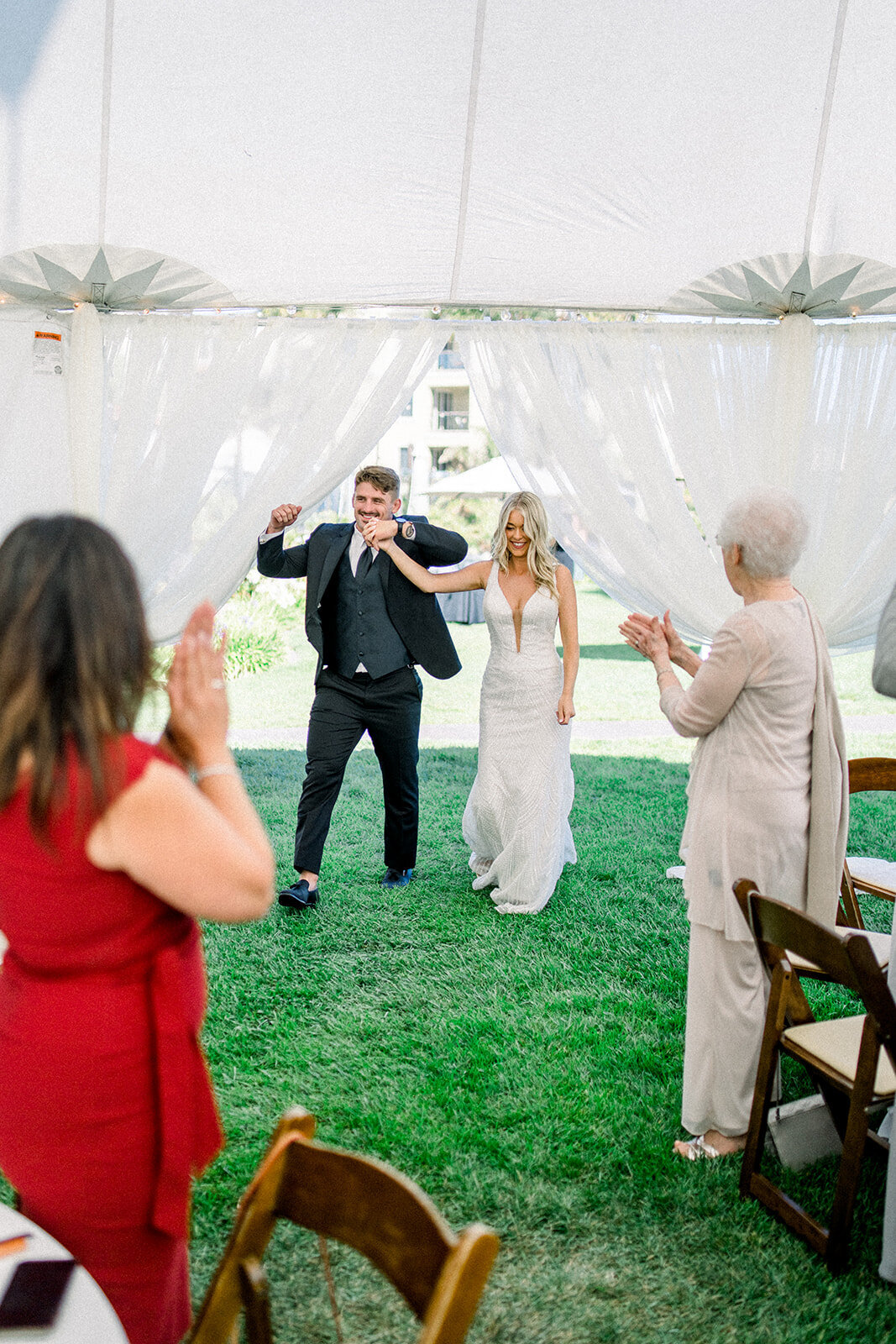 Bride and Groom grand entrance into wedding reception at Dolphin Bay Resort in Pismo Beach, CA