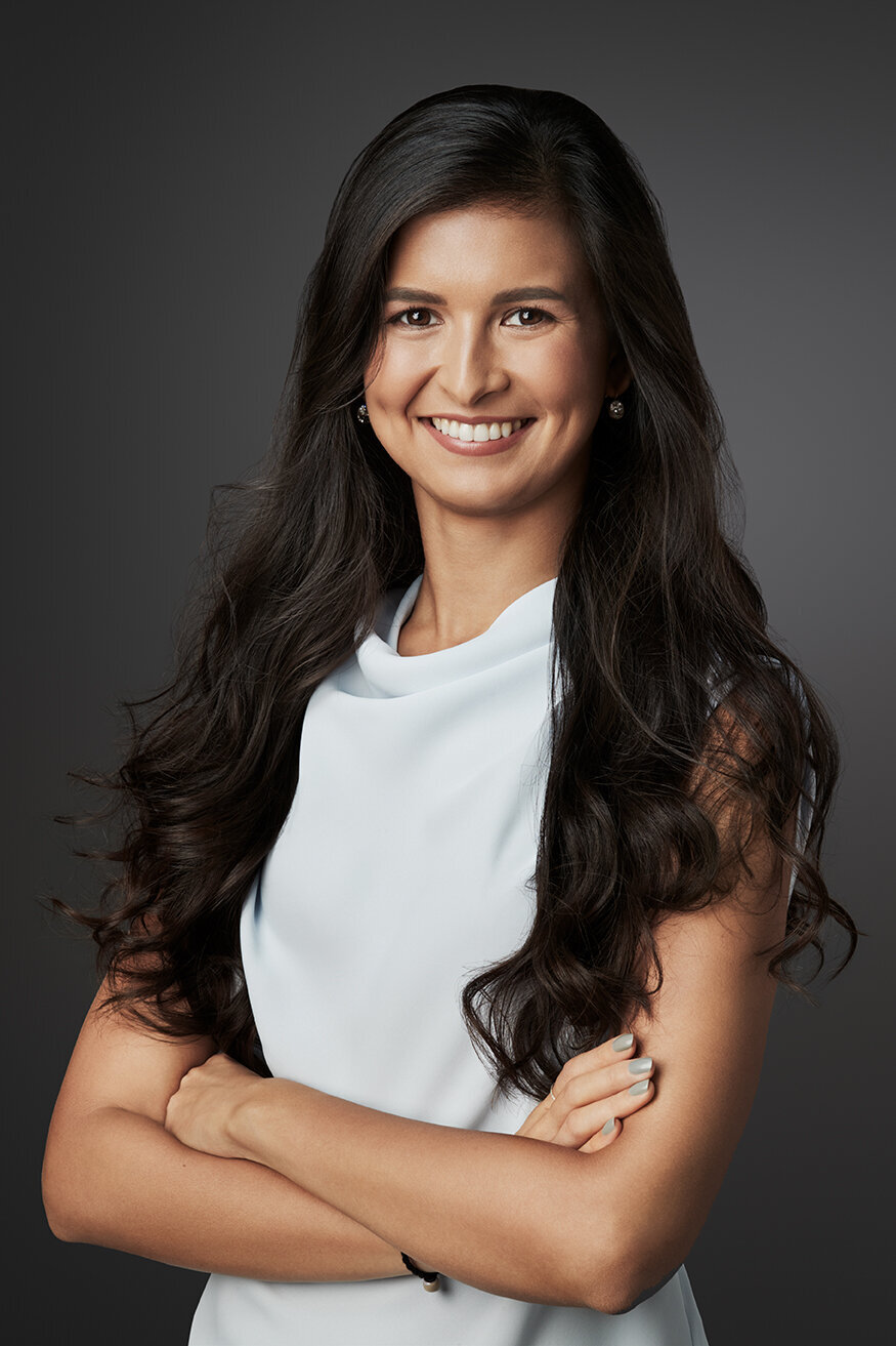Confident corporate portrait of Edyta Krejner with long hair, captured by Ylva Erevall.