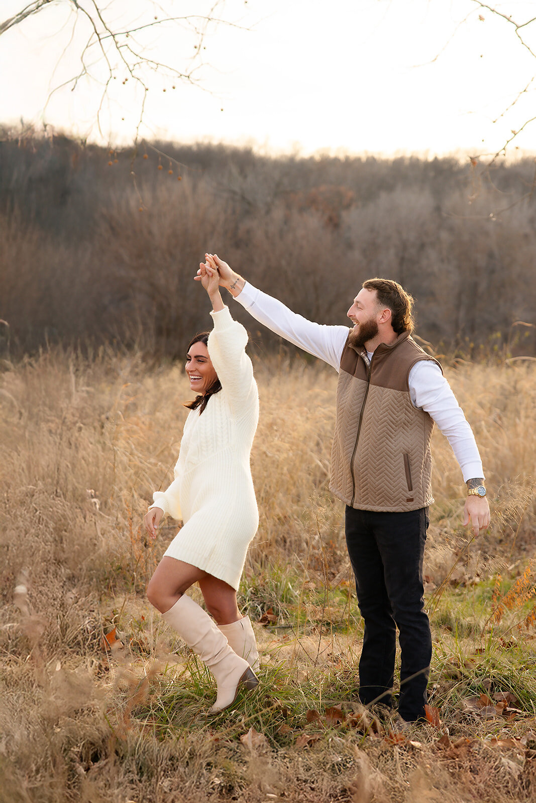 Engaged Couple dancing in field