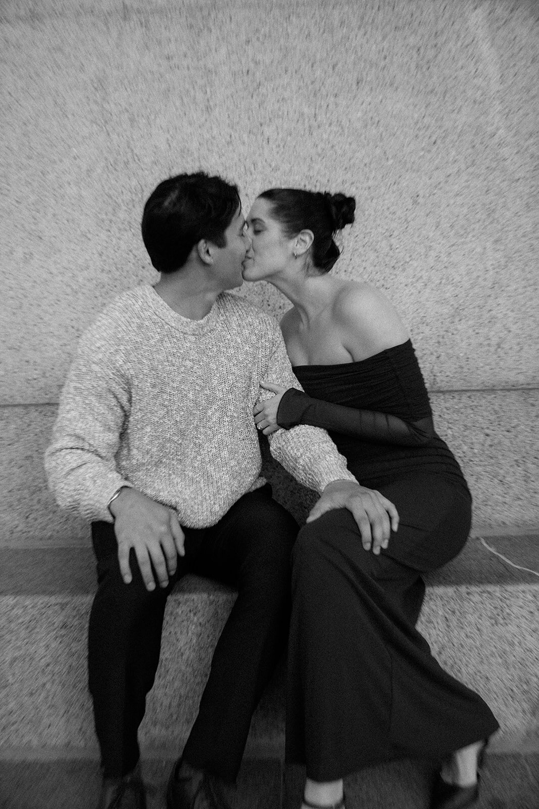 Couple leans in for a kiss after getting engaged at the Parthenon in Nashville, TN.