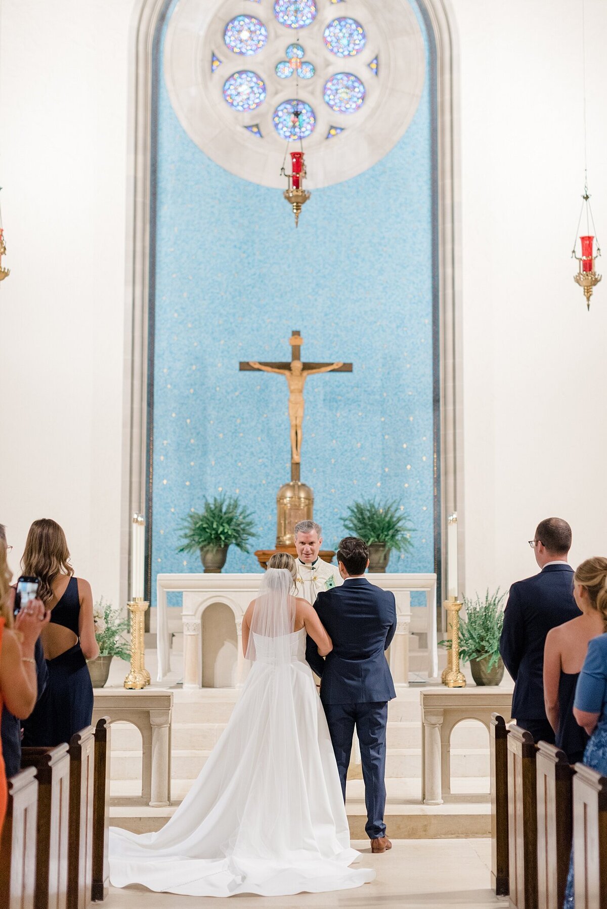 Bride holding Groom's arm at wedding ceremony taken by Ohio Wedding Photographers