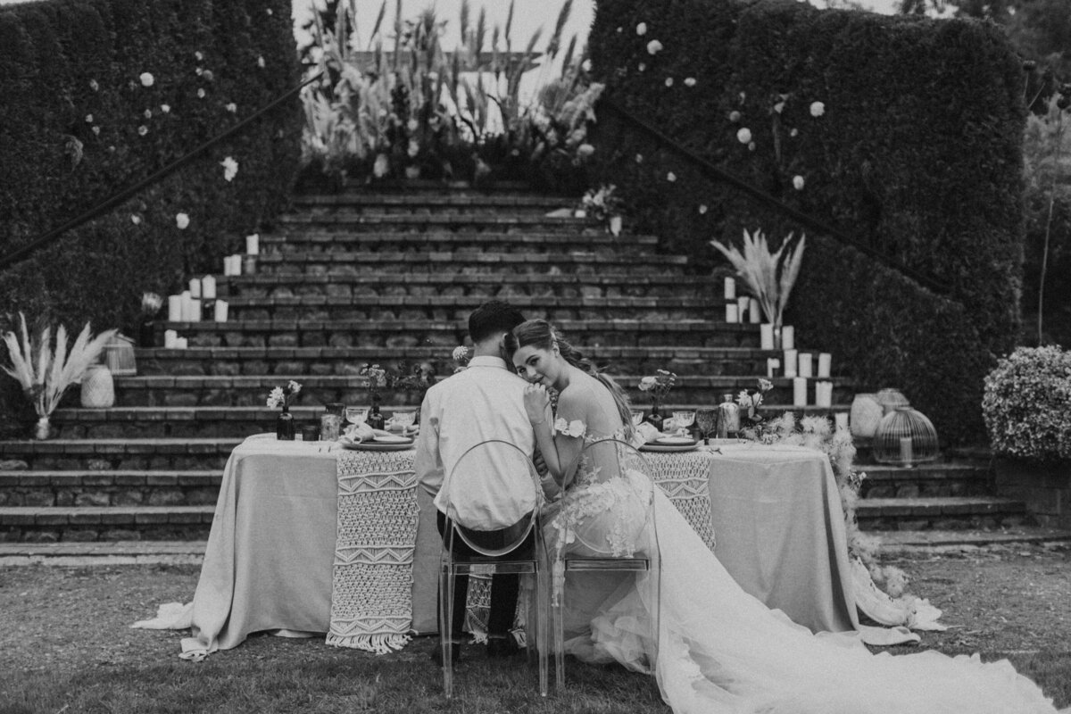 groom holding bride's shoulders