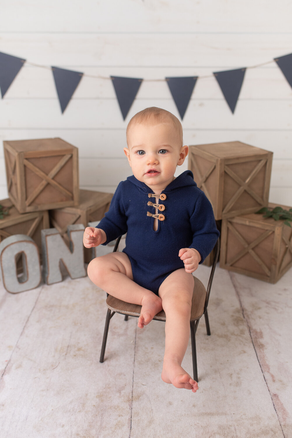 One year old boy on his first birthday at his cake smash session Blue, tan and white cake smash session at studio in Canton, CT |Sharon Leger Photography | Canton, CT Newborn & Family Photographer