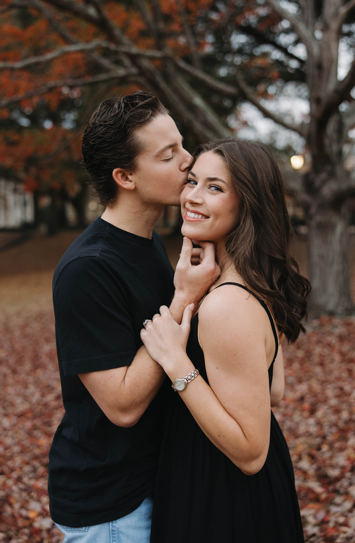 man kissing his wife on the head 