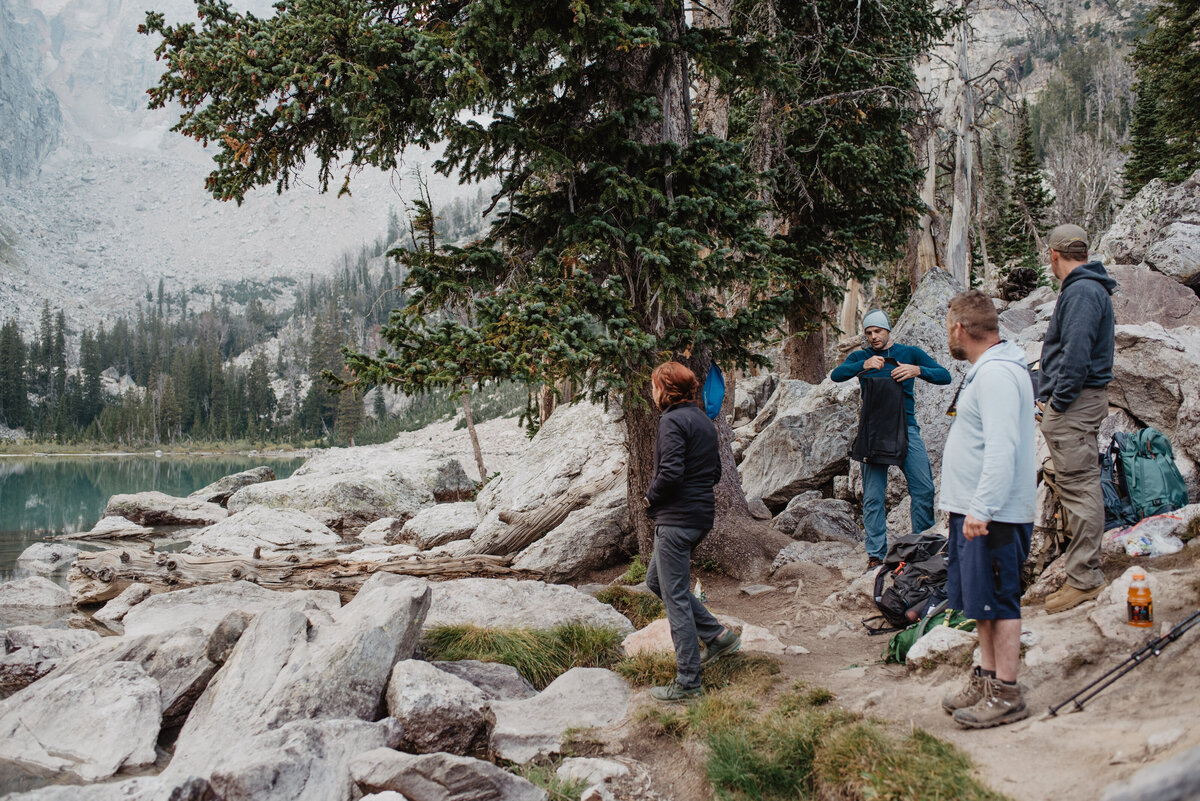 Jackson Hole Photographers capture wedding guests standing on rocks