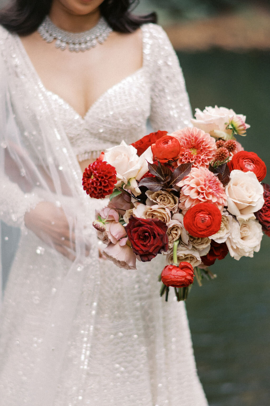 Lush red and blush floral aisle arrangements at indoor wedding ceremony at Old Edwards Inn in Highlands, NC.
