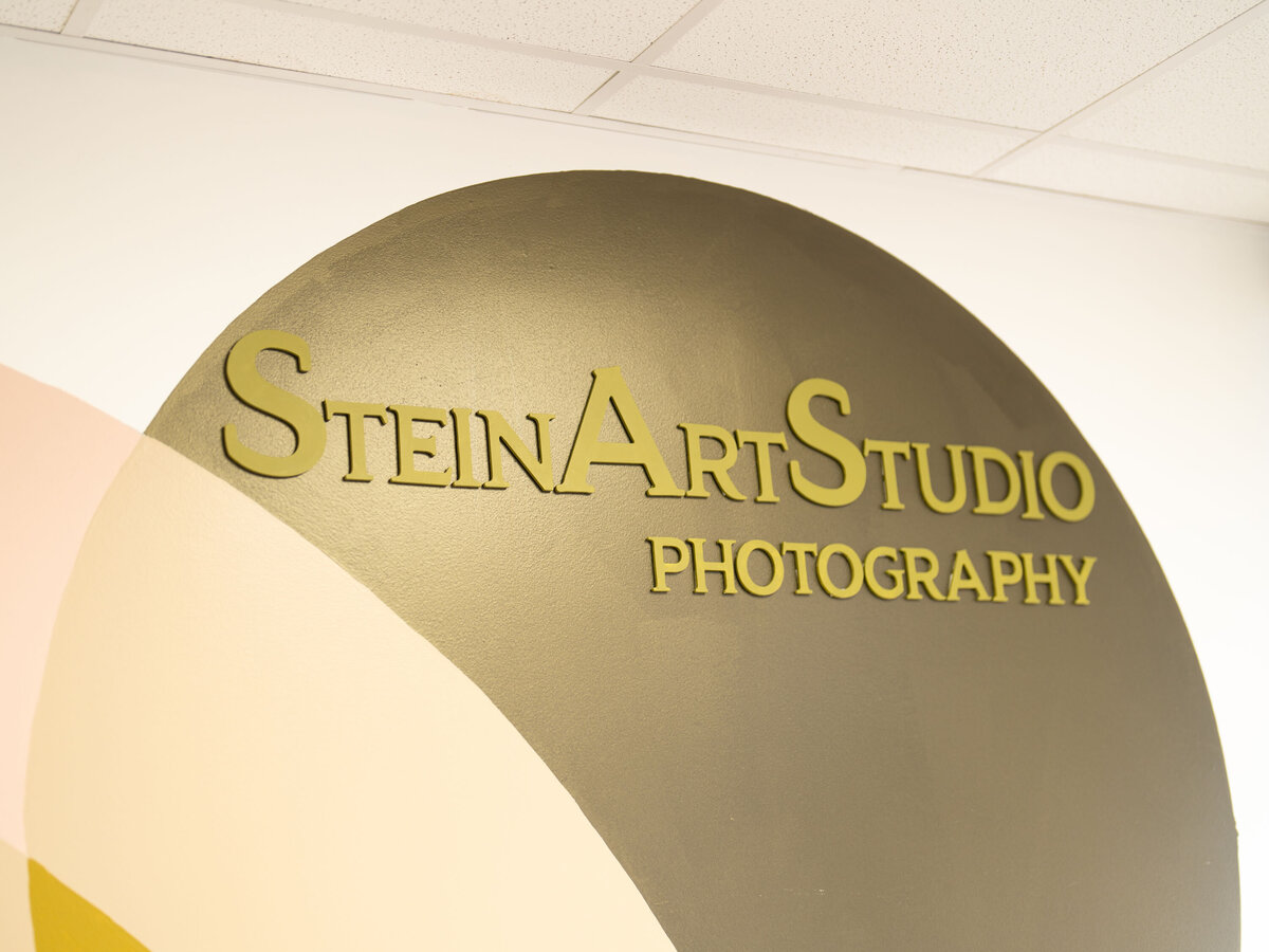 Photo of business sign for SteinArtStudio, an Orlando based maternity and newborn photography studio