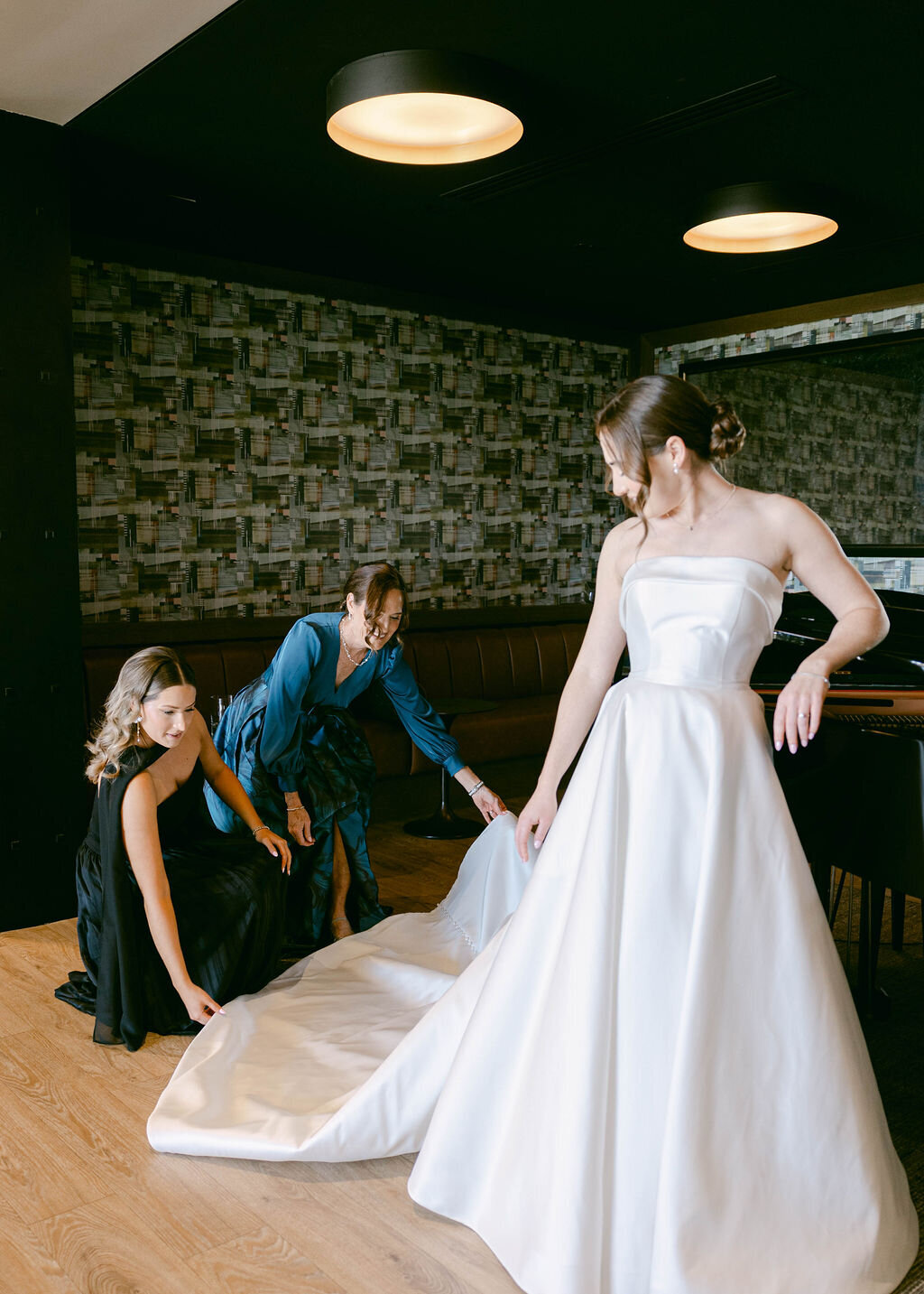 Bride getting ready with family before wedding ceremony at Arizona Biltmore Golf Club
