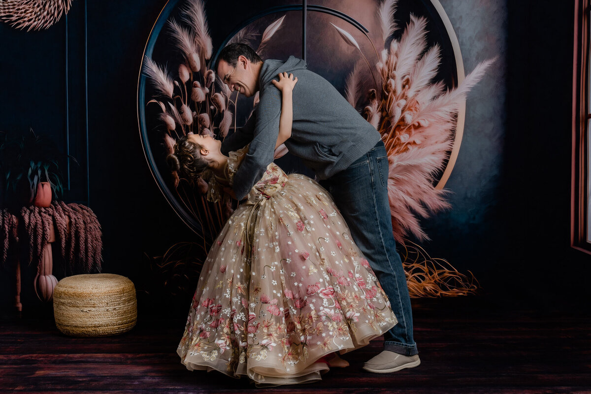 Dad dips daughter while dancing in Prescott family photography session with Melissa Byrne