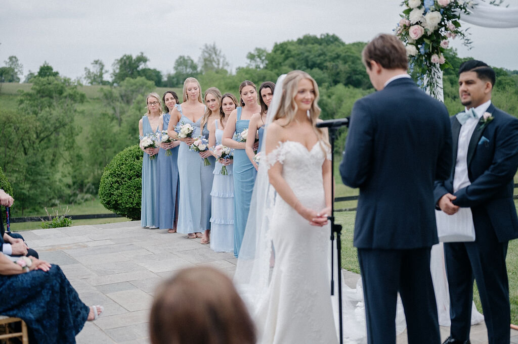 On going wedding reception while groom saying his vows