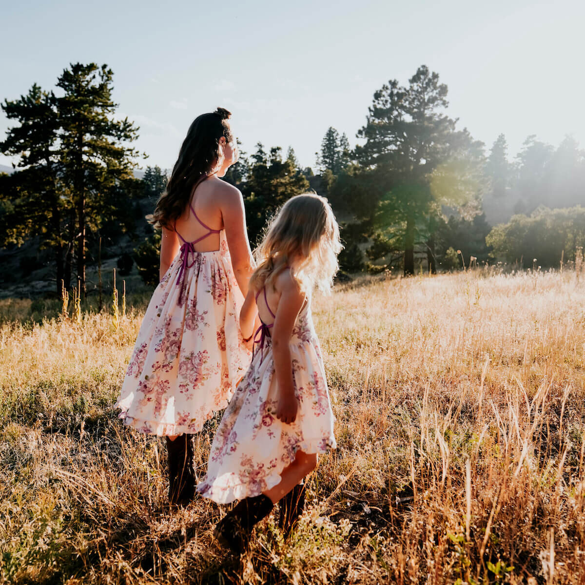 denver family photography - two girls walking in field