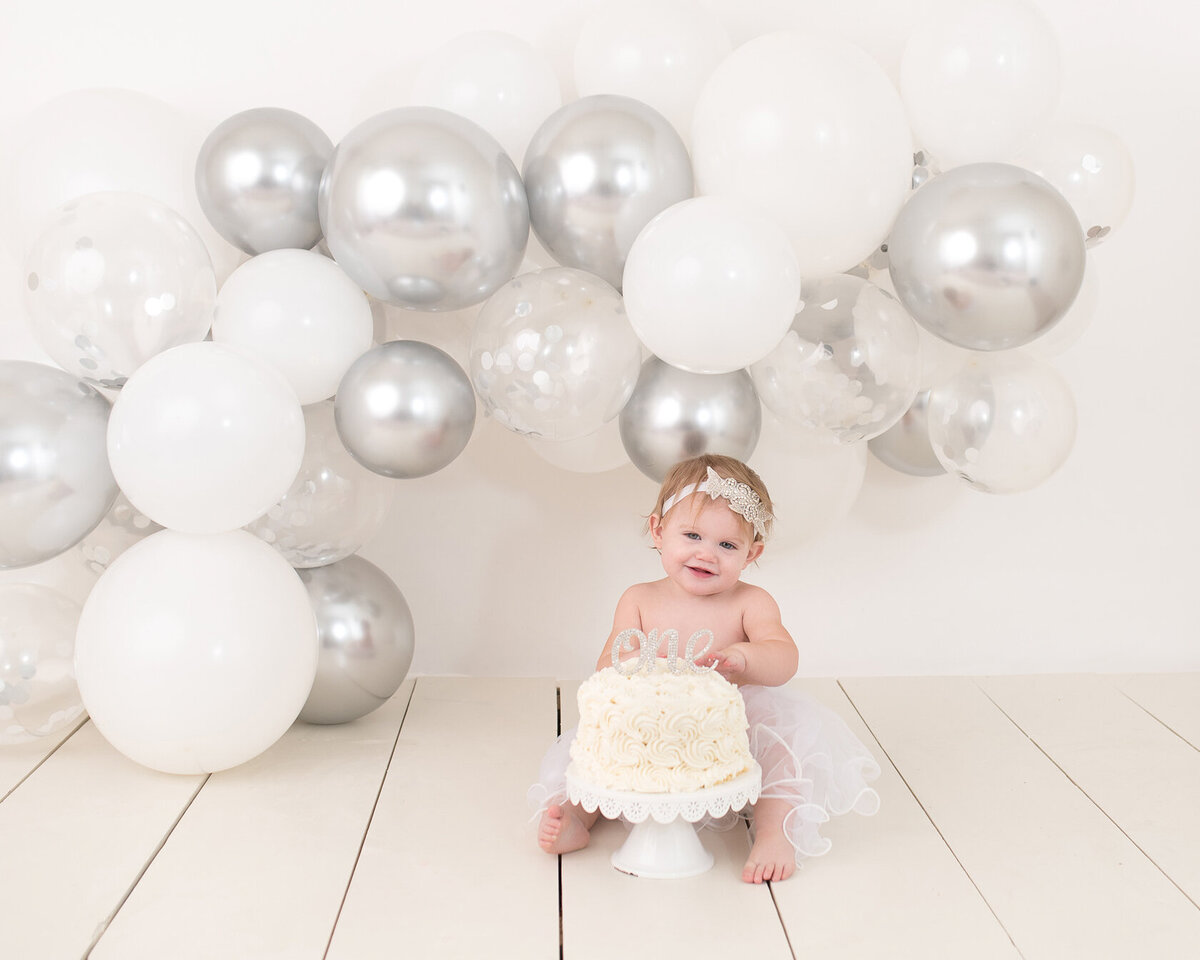 White and Silver baby cake smash themed photoshoot in Houston