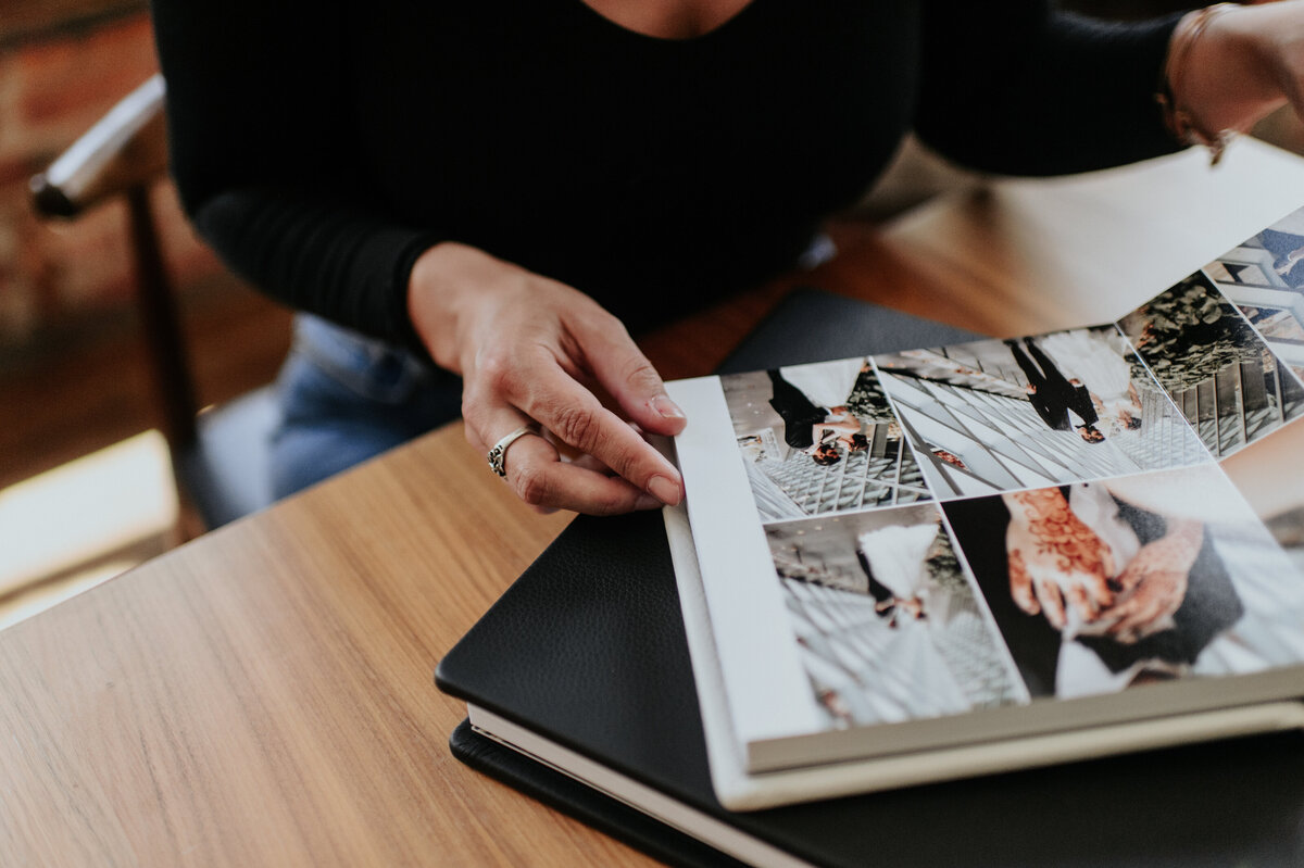 Heirloom wedding album open on a wooden table