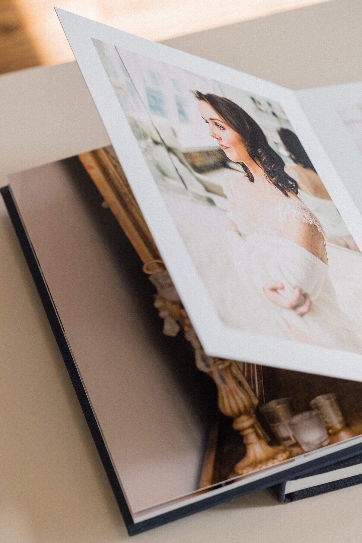A bride gifts a stunning boudoir album to her soon-to-be husband for their wedding day