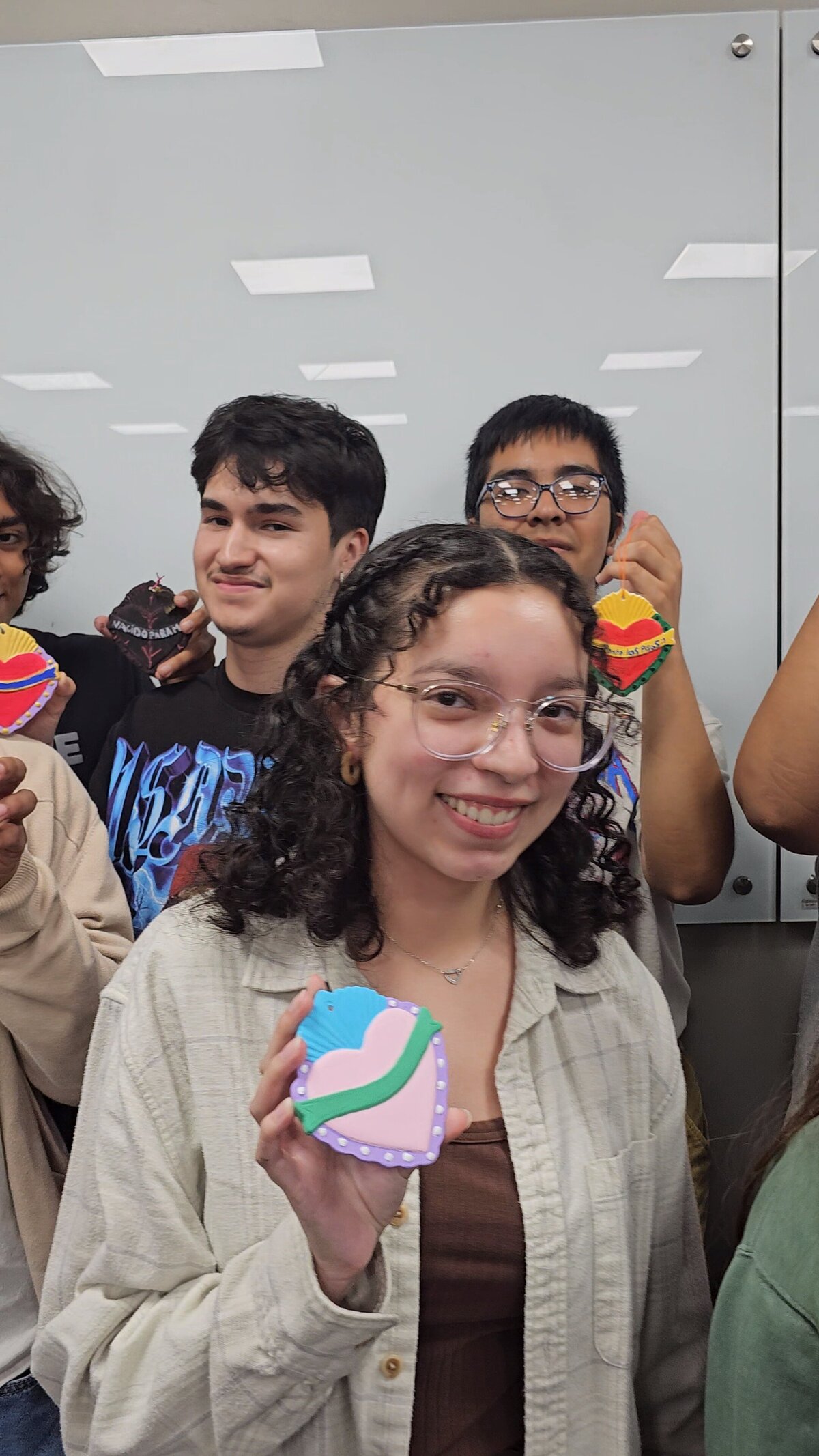 The collective achievement as a group of participants proudly presents the final products from the art workshop conducted by the creator of Soleil Vida Studio.