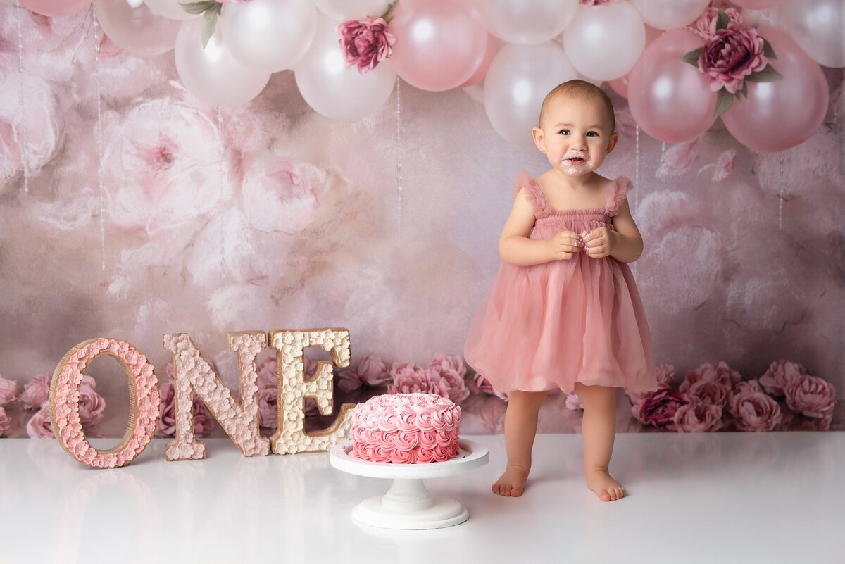 Floral girly first birthday cake smash in Wellington studio.