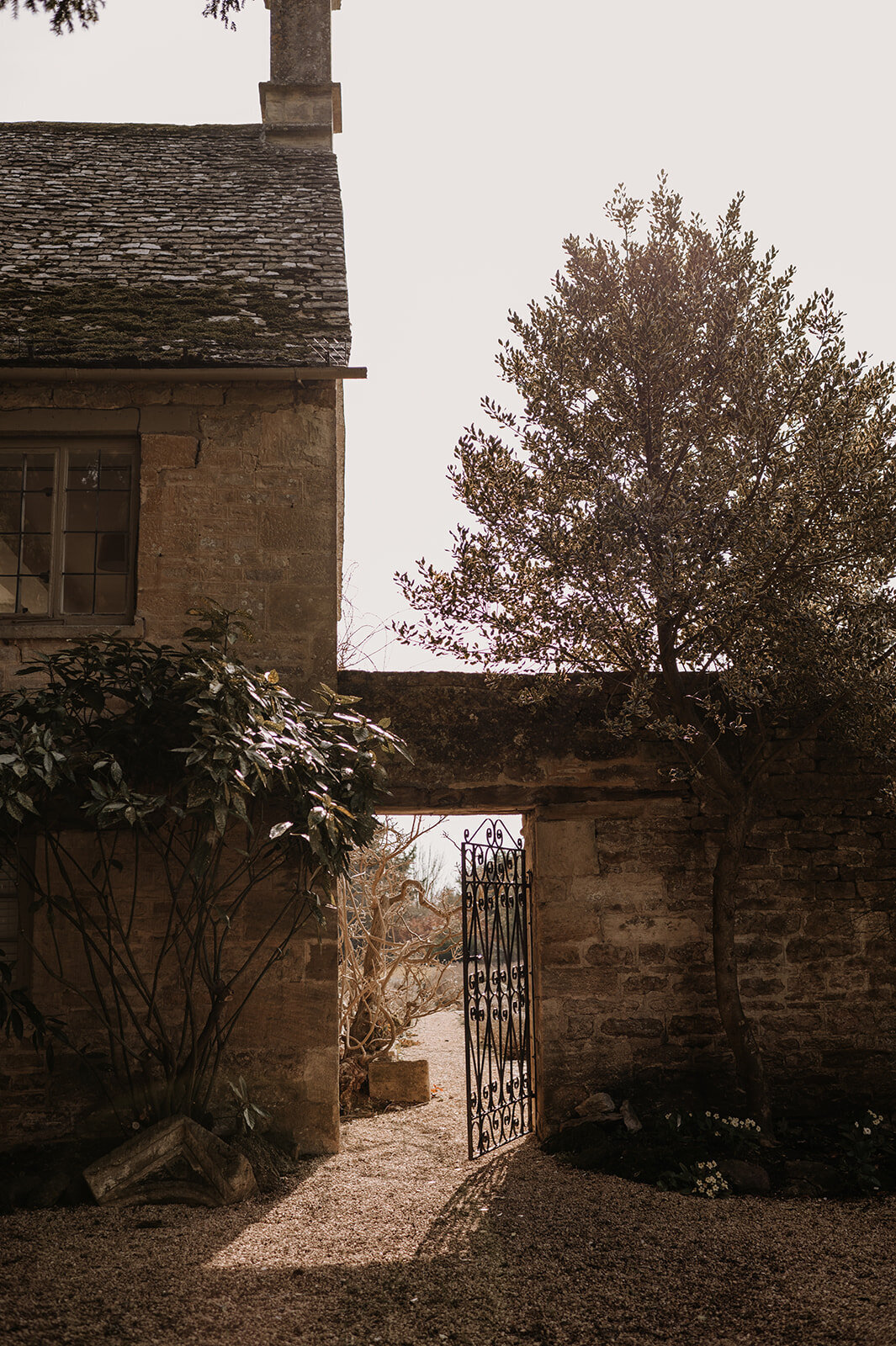 Frosty winter scene at Caswell House featuring the garden gate and estate grounds