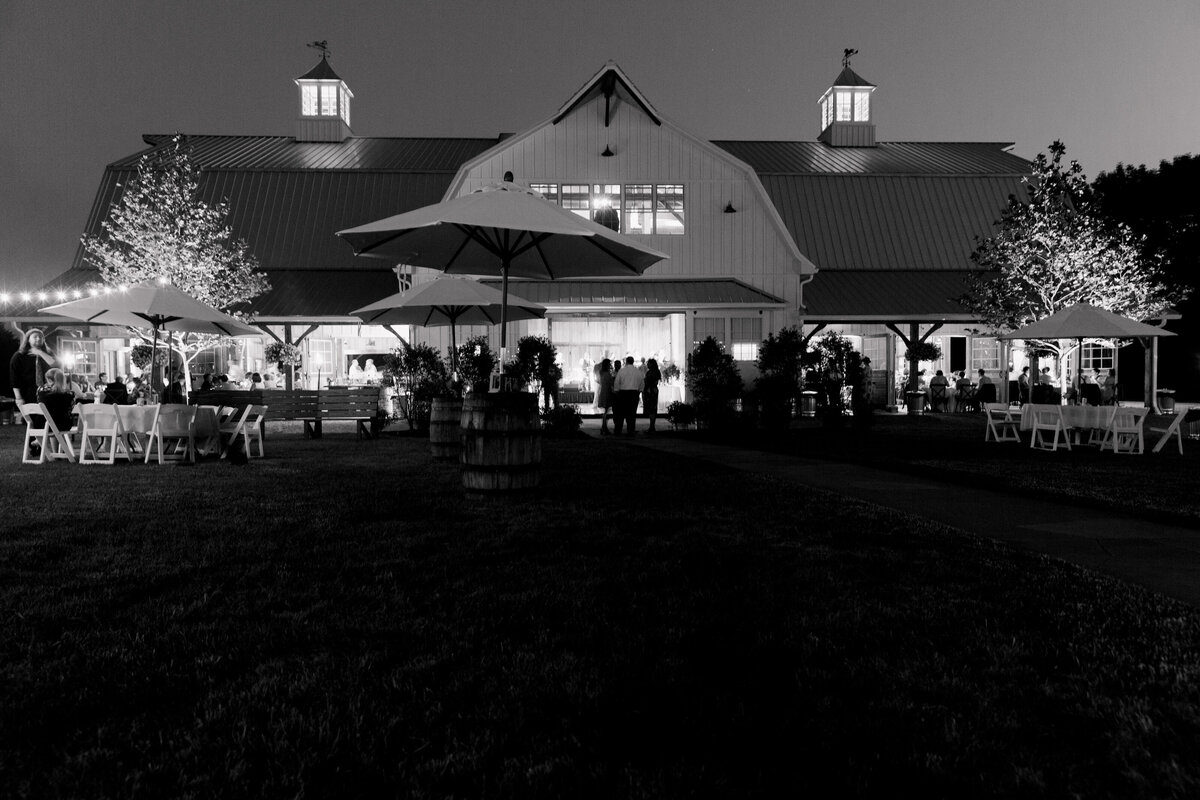 Black and white exterior photo of Wildflower On Watts at nighttime