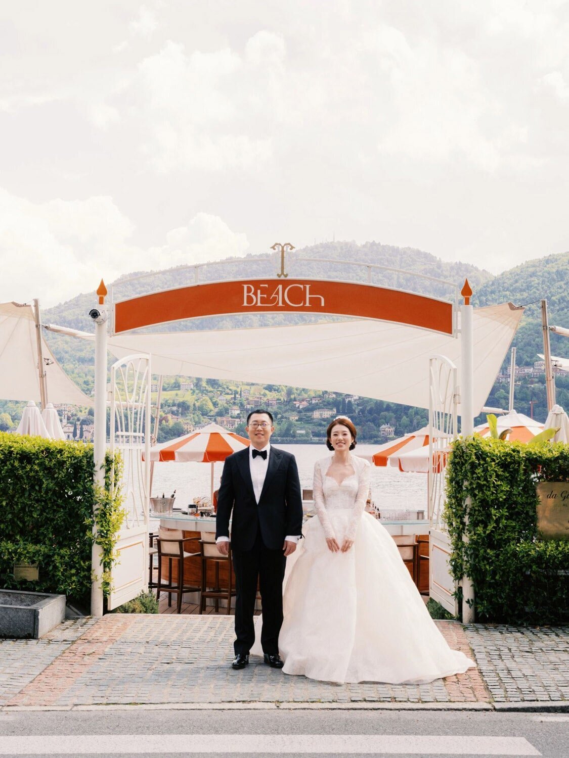 Beach-side wedding portraits of a couple during Grand Hotel Tremezzo wedding, by Lake Como Wedding Photographer Andreas K. Georgiou