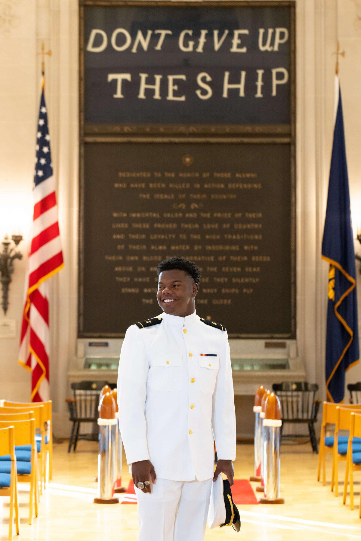 Midshipman Sailor in US Navy Portrait in Memorial Hall at the Naval Academy in Annapolis, Maryland.
