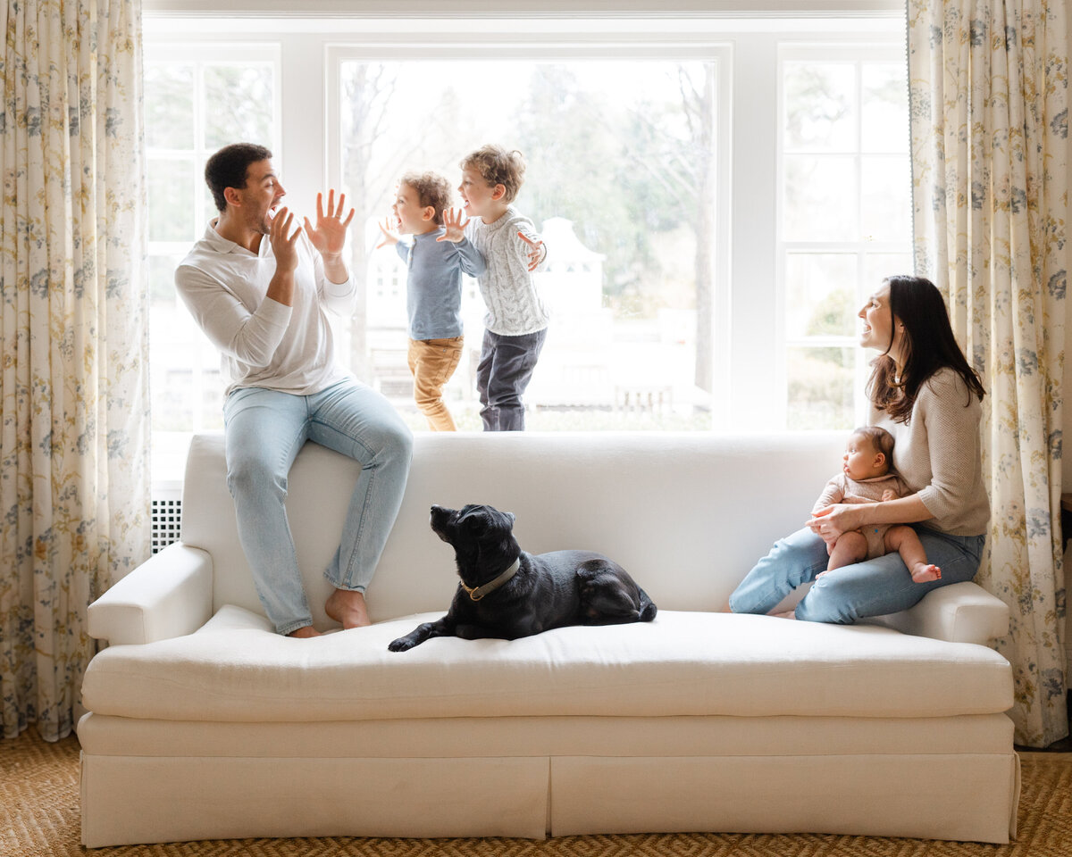 Dad surprises his two young sons during at-home family photography session