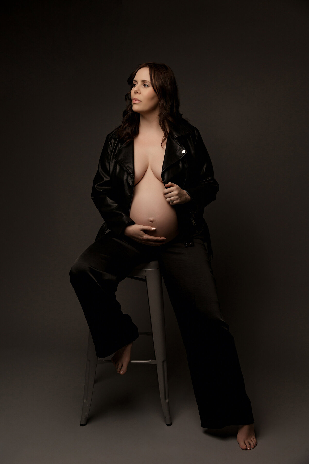 mom in silk pants and leather jacket for phoenix maternity session