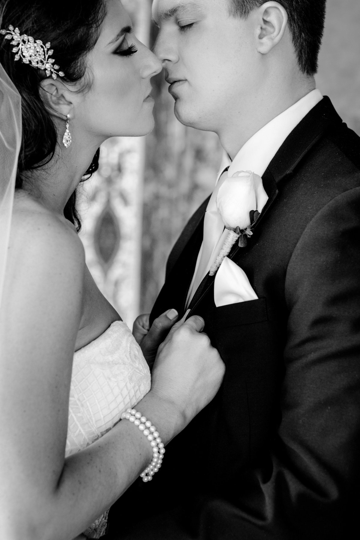 bride and groom kissing at monmouth university wedding
