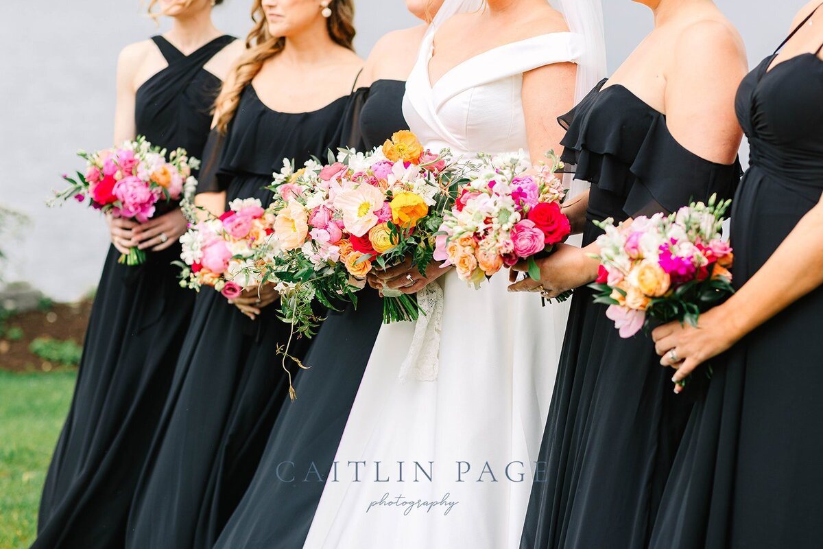 Bride and bridesmaids holding bouquets