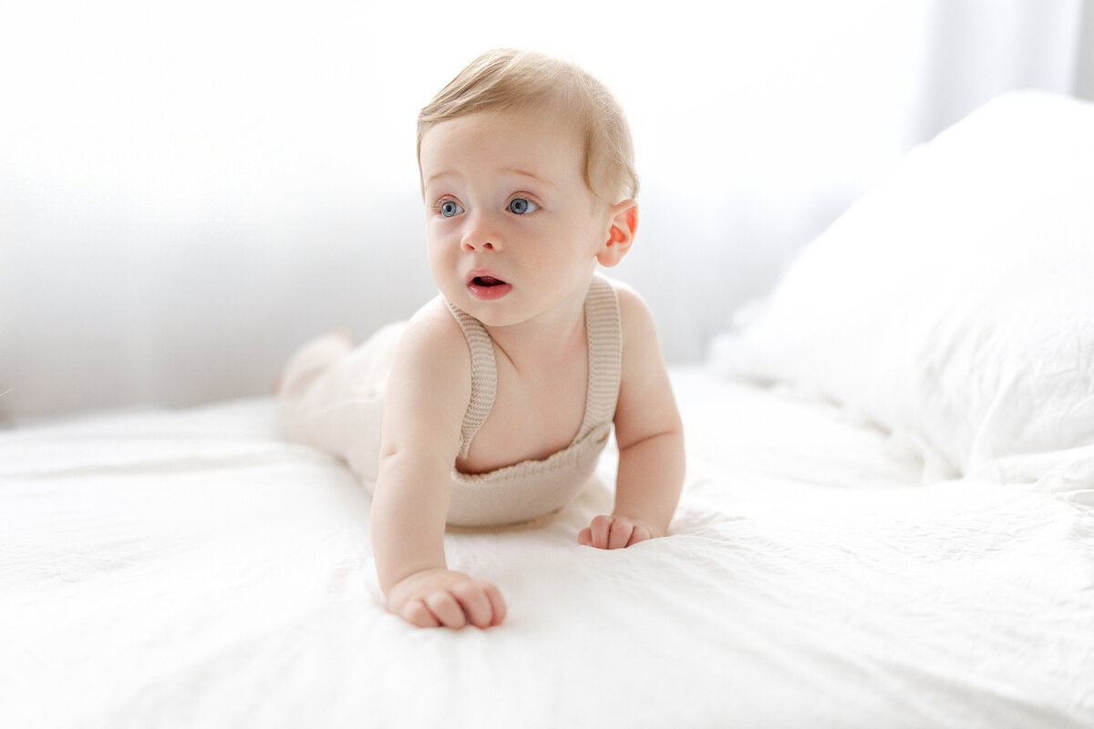 Tampa 6-month milestone portrait of smiling baby boy in natural light studio