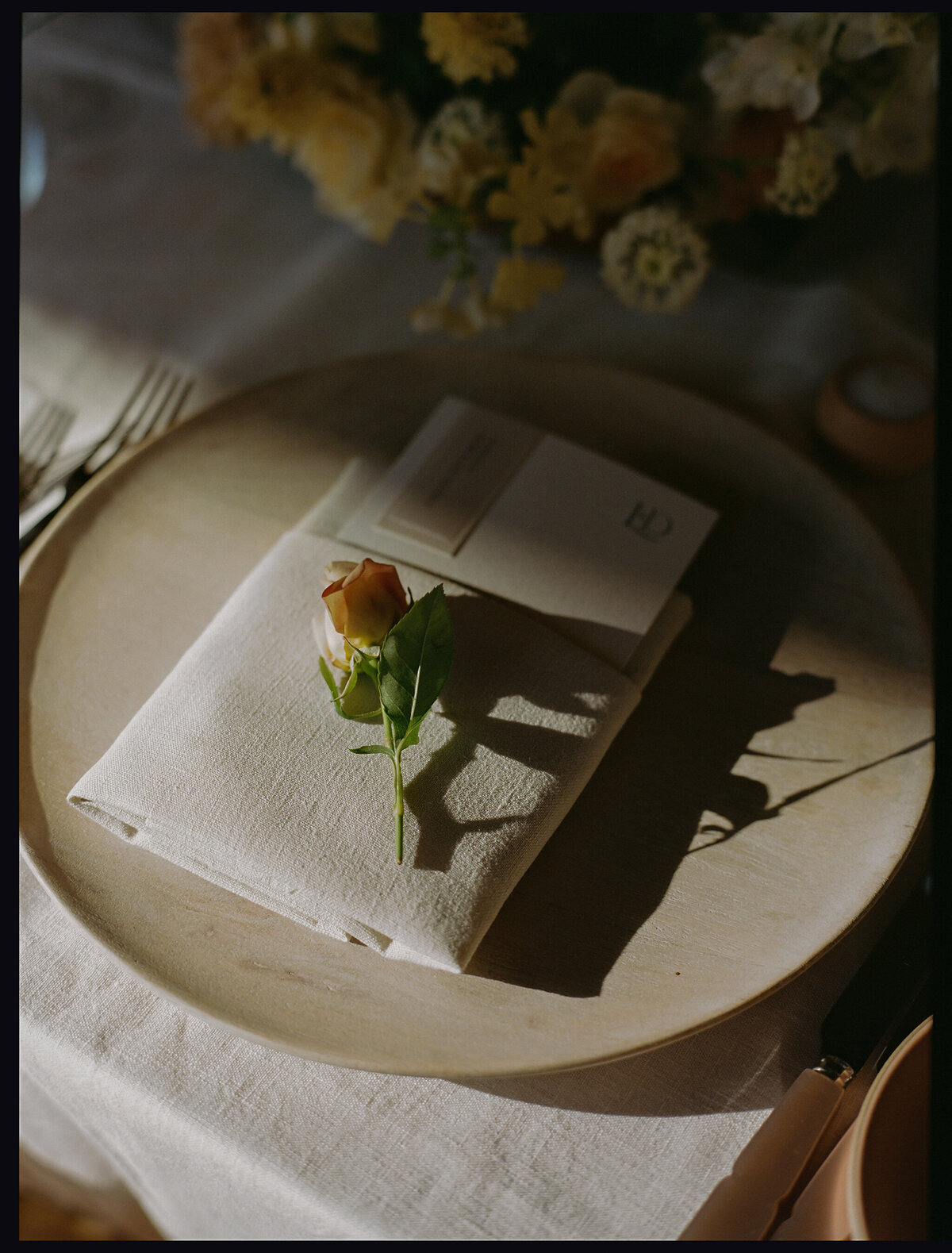 casa de perrin wedding china with theoni linen and simple menu topped with rose bud treatment