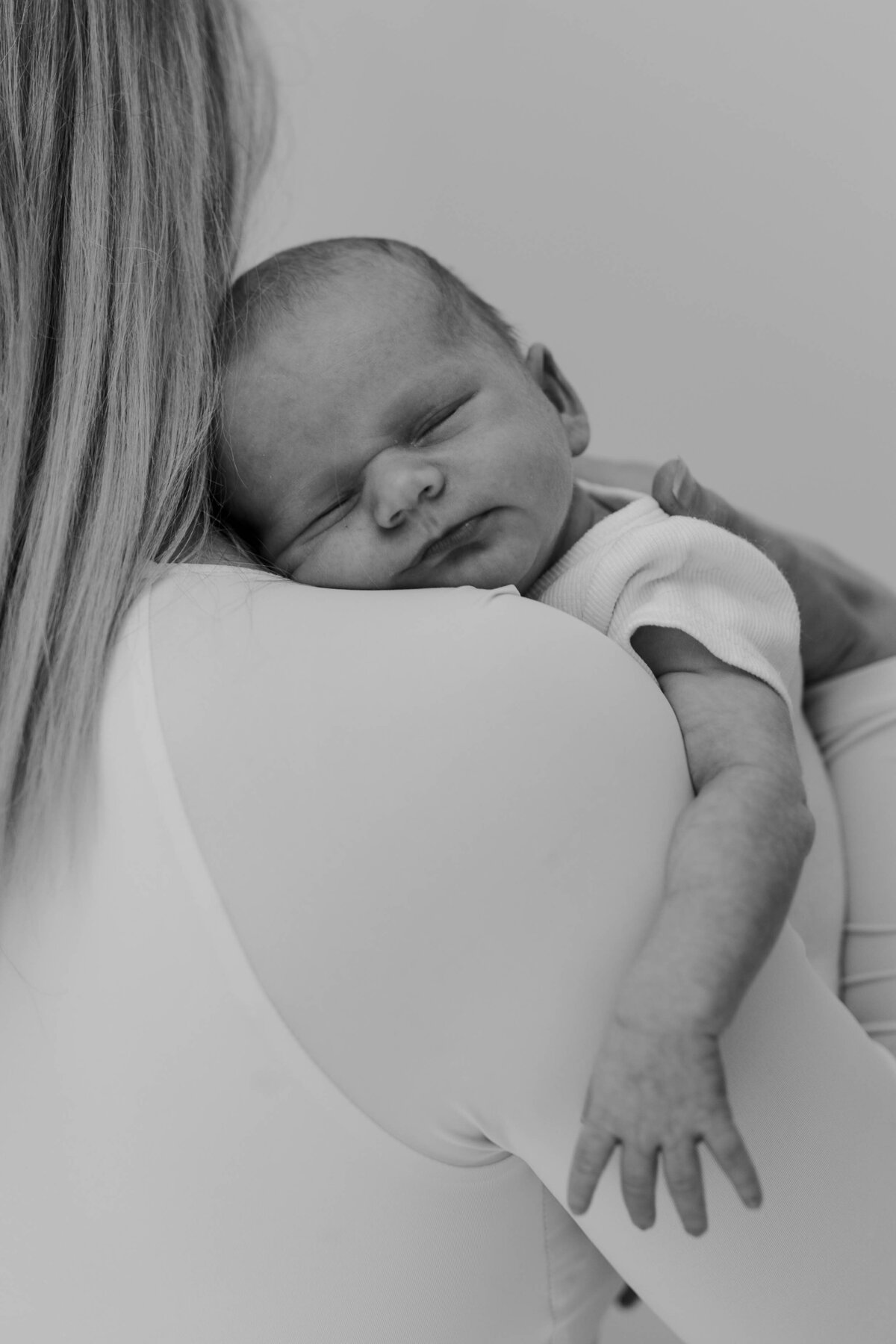 Newborn and mother black and white image