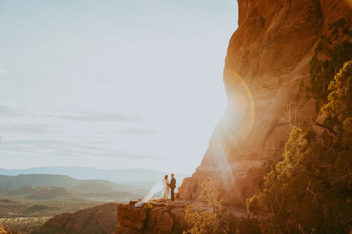 bride and groom on catehdral rock