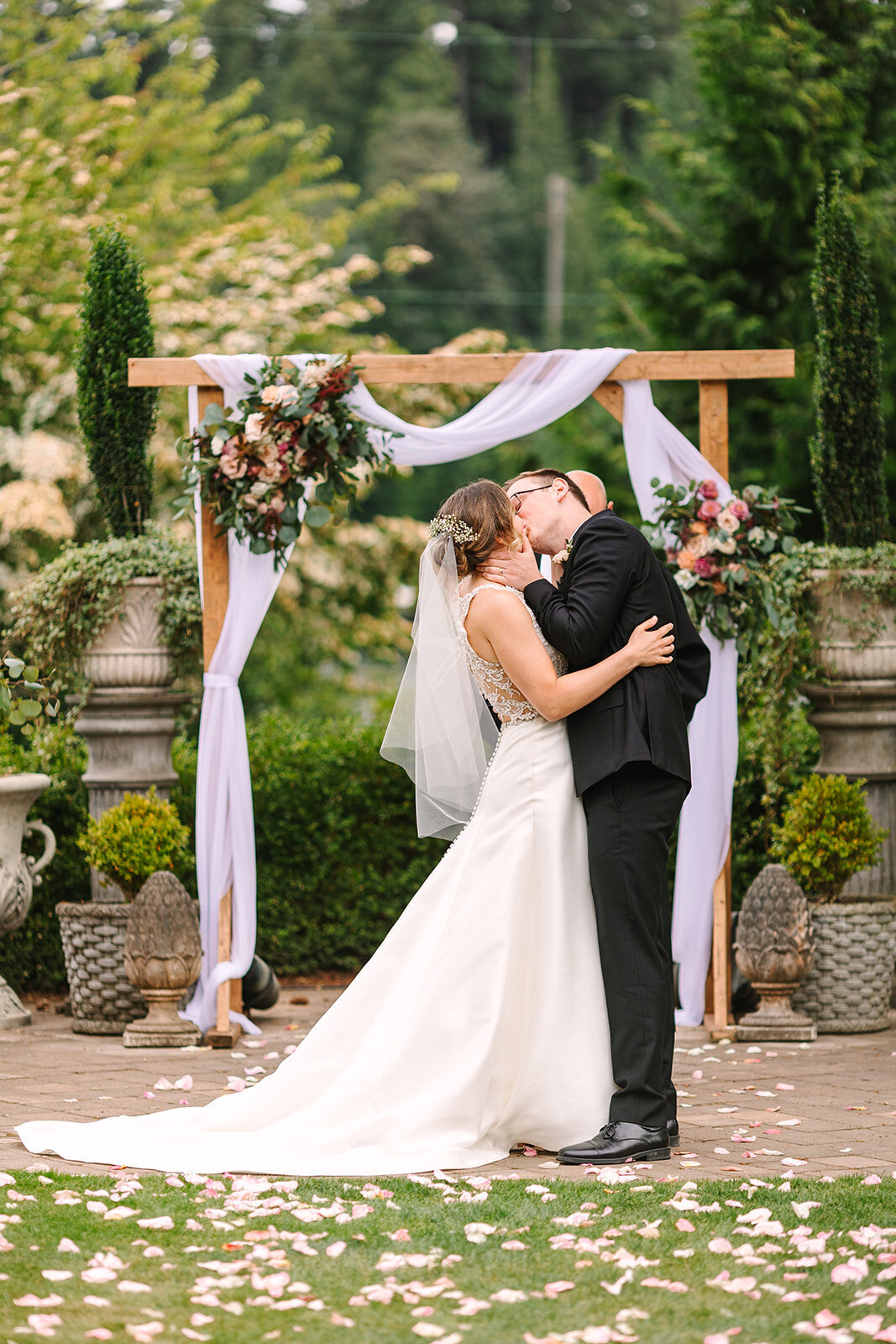 Wedding Ceremony First Kiss Photos at Snohomish Wedding Venue Greengates at Flowing Lake