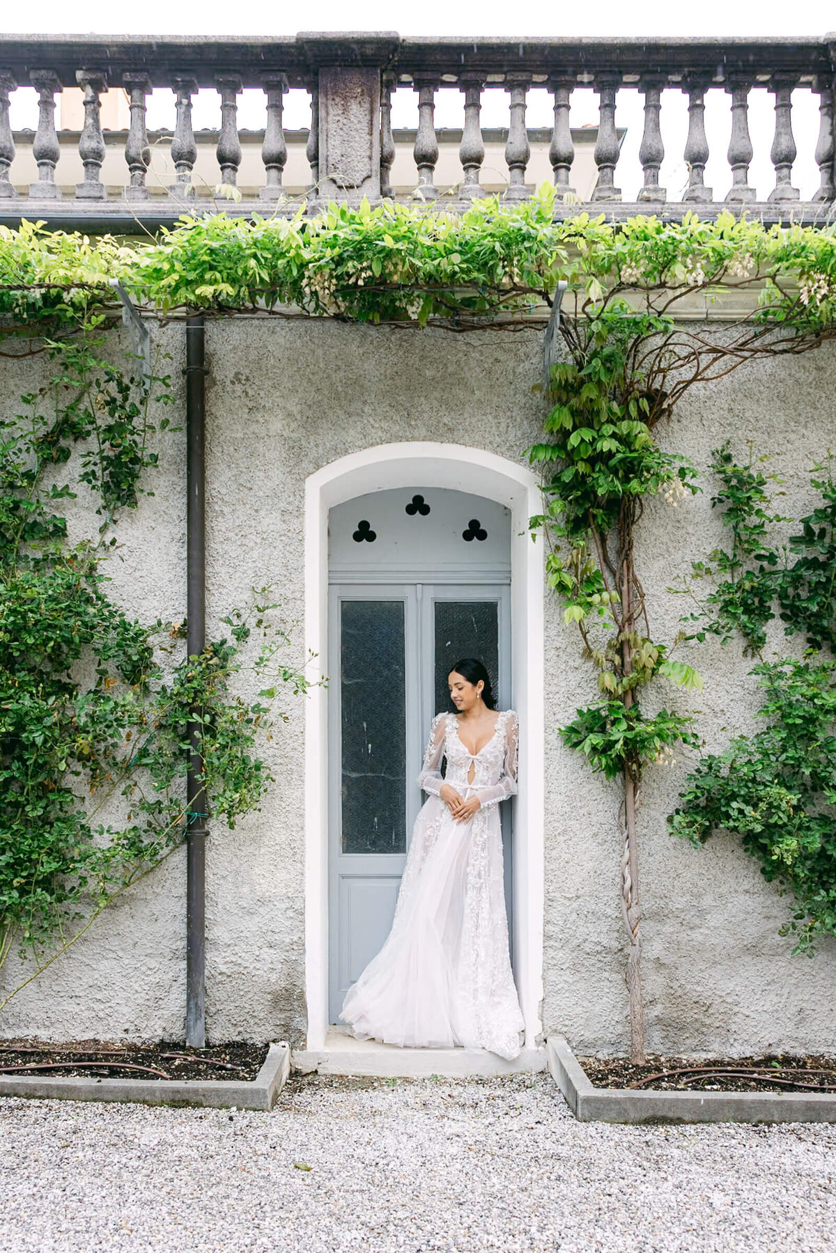 A wedding day bridal shot of a bride in her white dress at Villa Aura del Lago on lake como in Italy