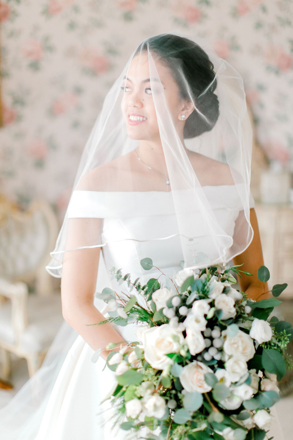 This image likely portrays the bride in a fine art photography style, emphasizing the artistic and elegant aspects of bridal photography