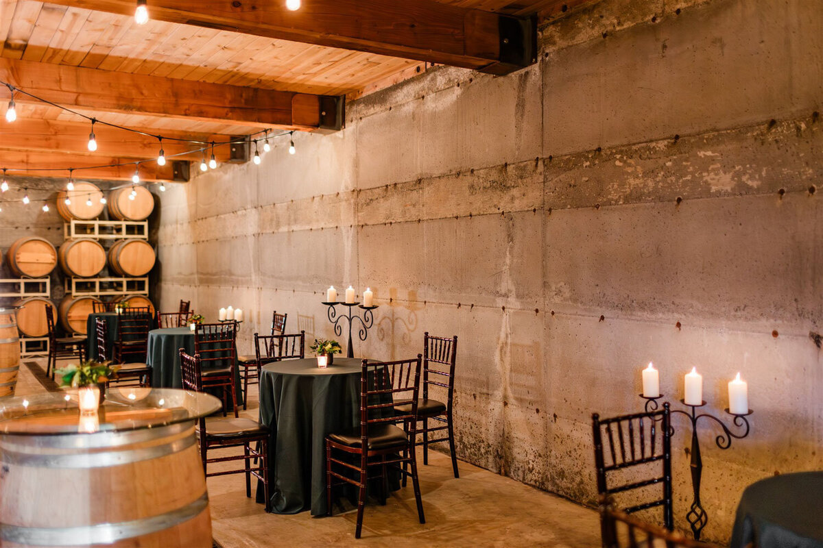 The Barrel room at Chateau Lill full of wine barrels