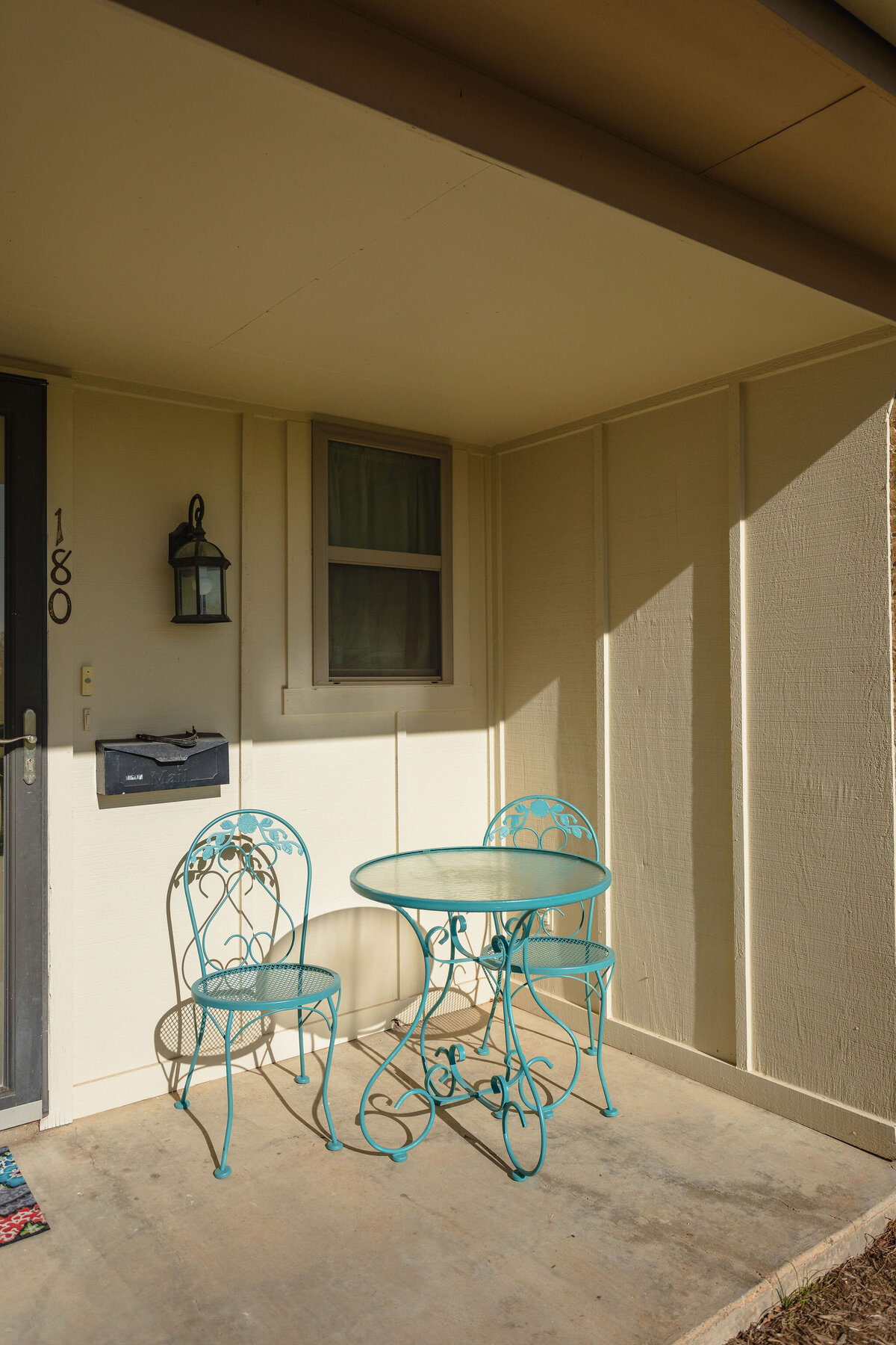 Patio table that seats two at this 2-bedroom, 2-bathroom lakeside vacation rental home for 6 guests on Tradinghouse Lake with privacy access to a fishing dock and boat launch pad, ping pong table, gazebo, free wifi and free parking in Waco, TX.